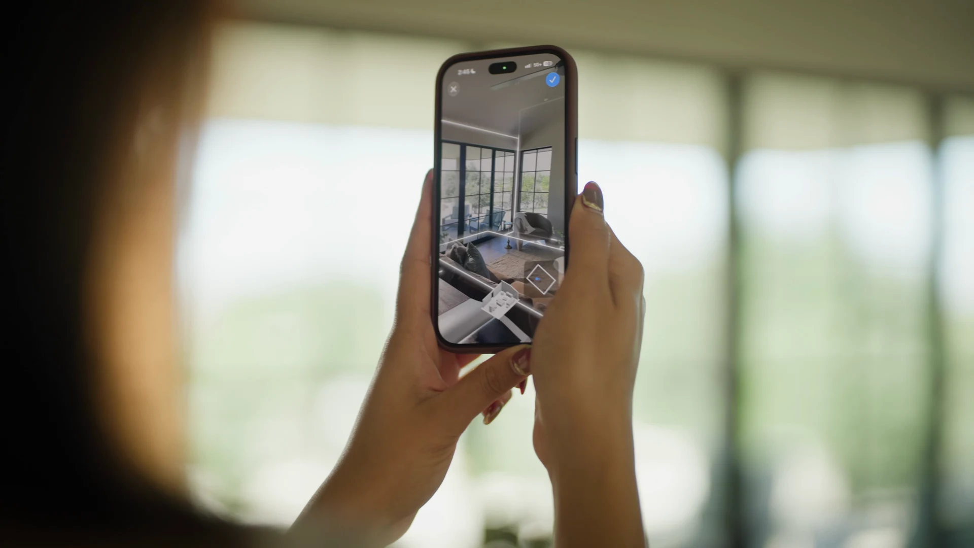 A person exploring a new design for their living room on a phone